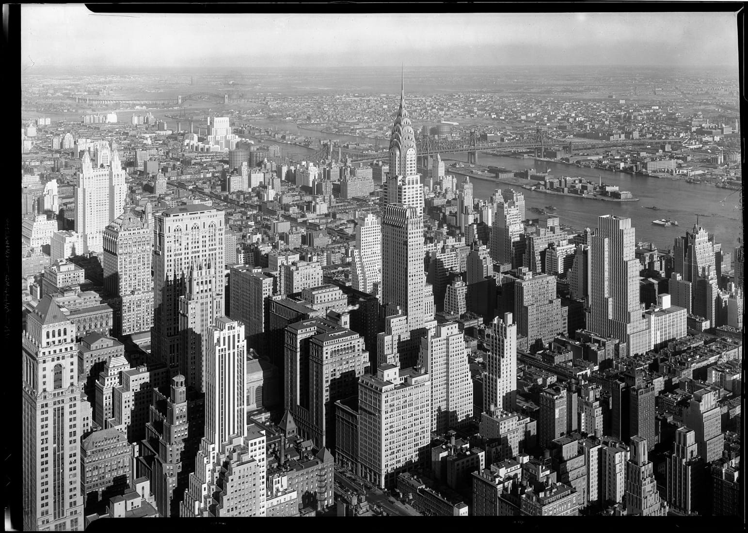 The Empire State Building rising over Manhattan in 1932, the year after it opened as the tallest building in the world.