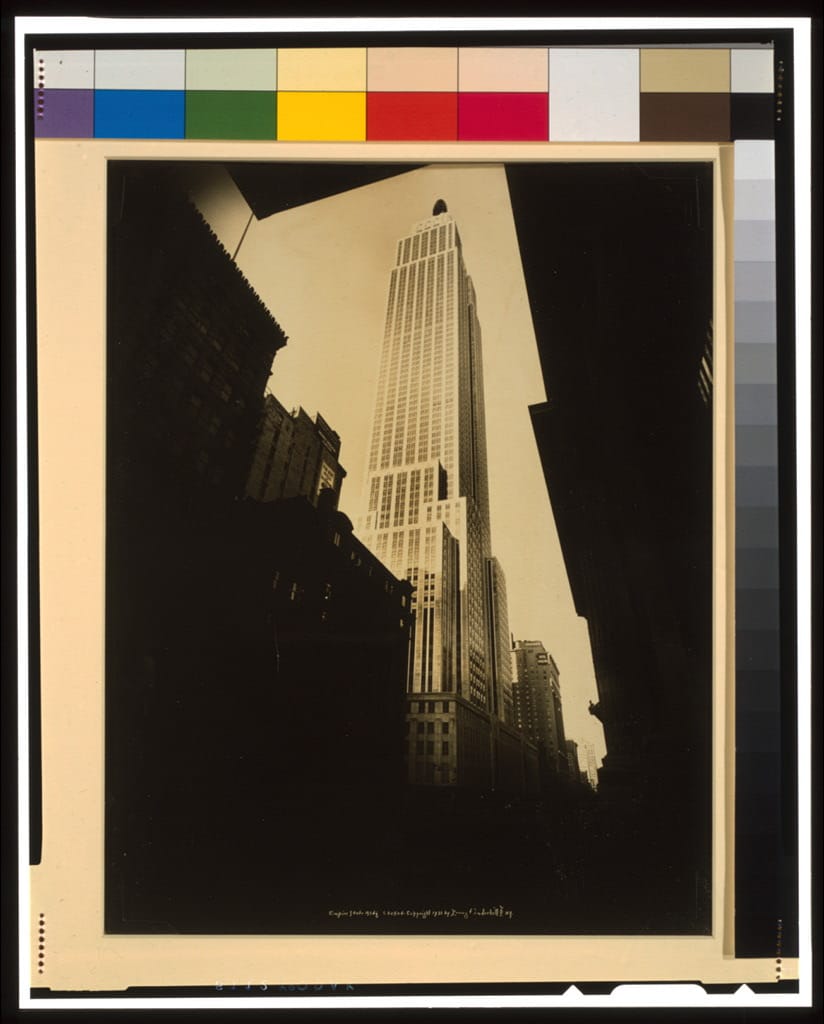 A photograph of the newly completed Empire State Building rising above lower Manhattan, around 1931.