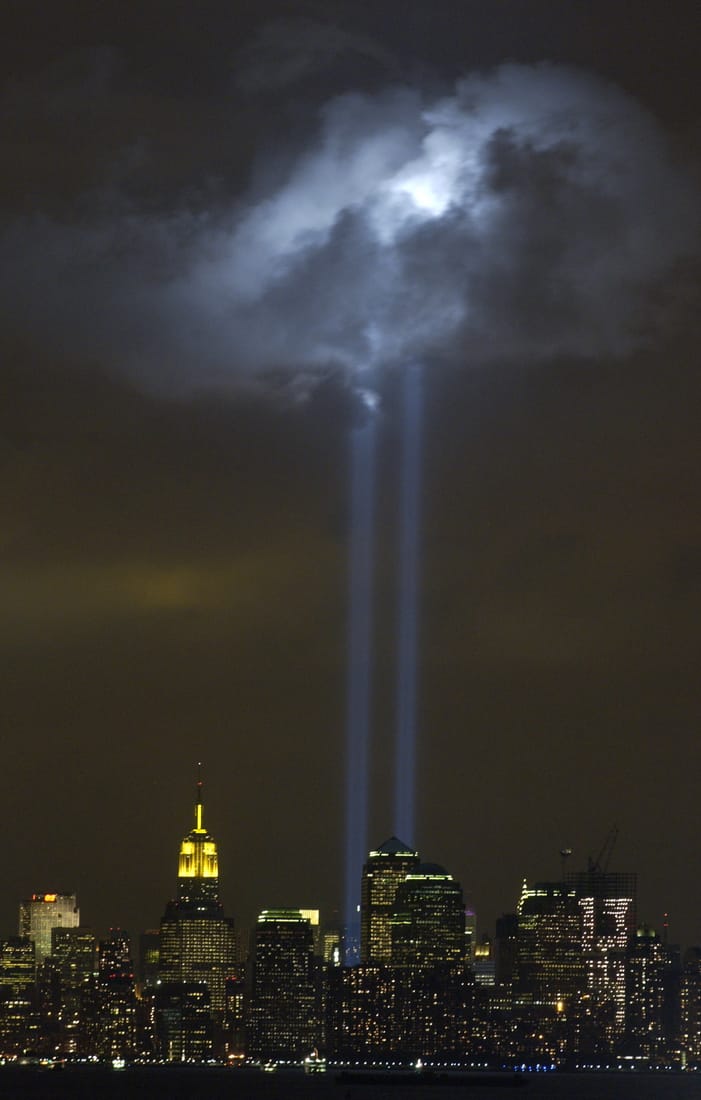 Two columns of light rising into the night sky over Lower Manhattan, a memorial to the World Trade Center towers.