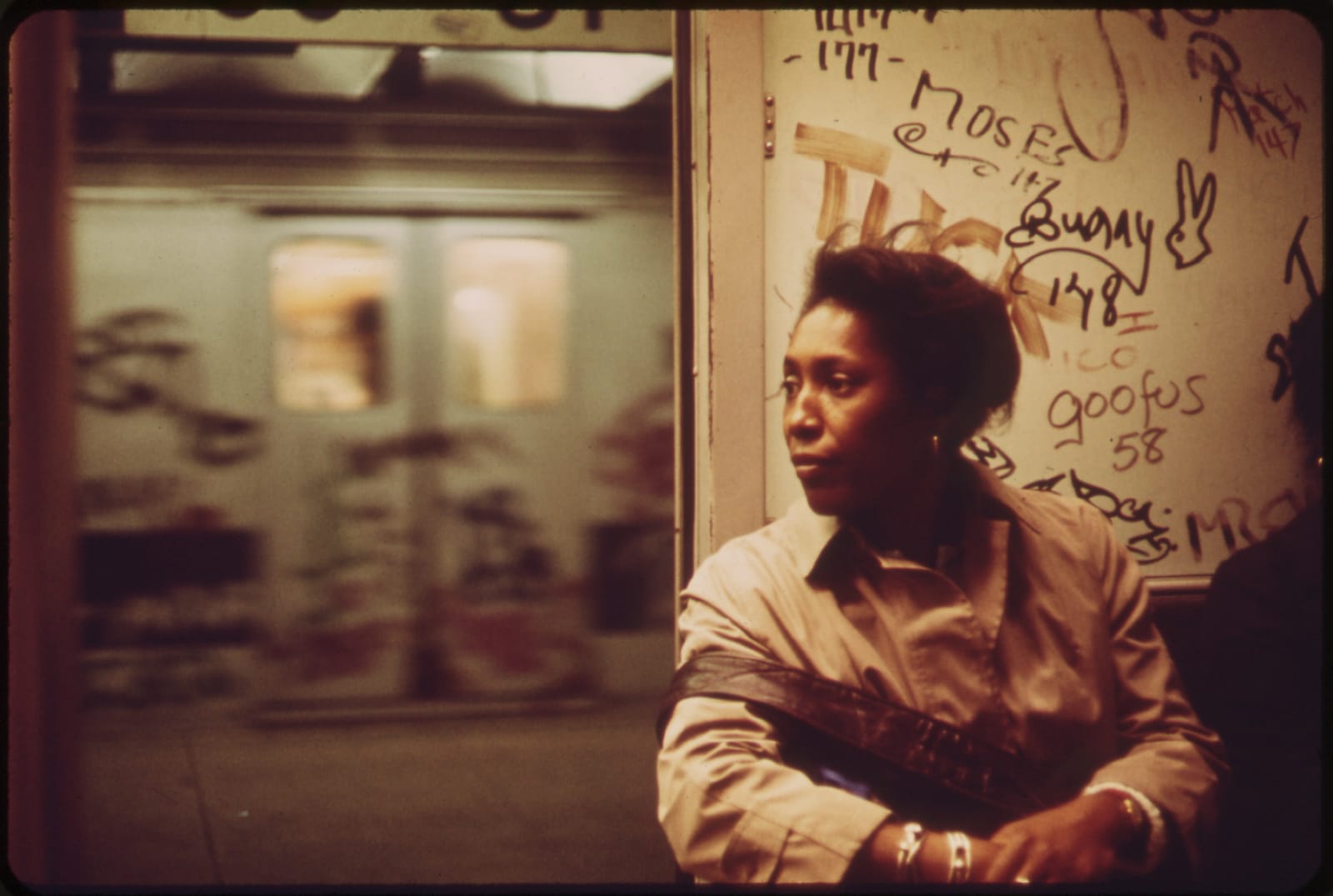 The interior of a New York City subway car covered in spray-painted graffiti in the 1970s, the era of the city’s disorder.